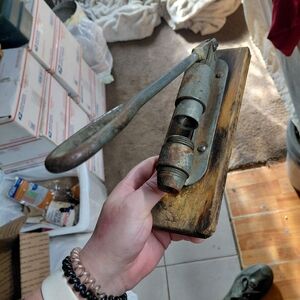 vintage mechanical nutcracker, specifically a Reed's Rocket Pecan Cracker.